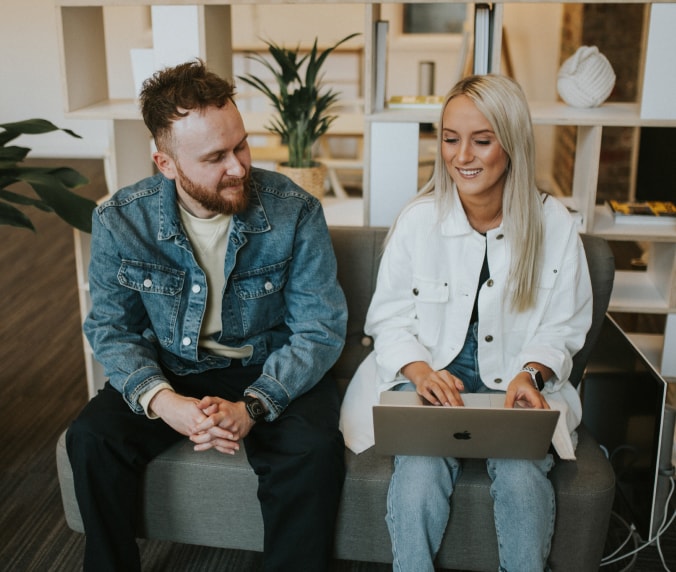 Dan and Ashley looking at laptop